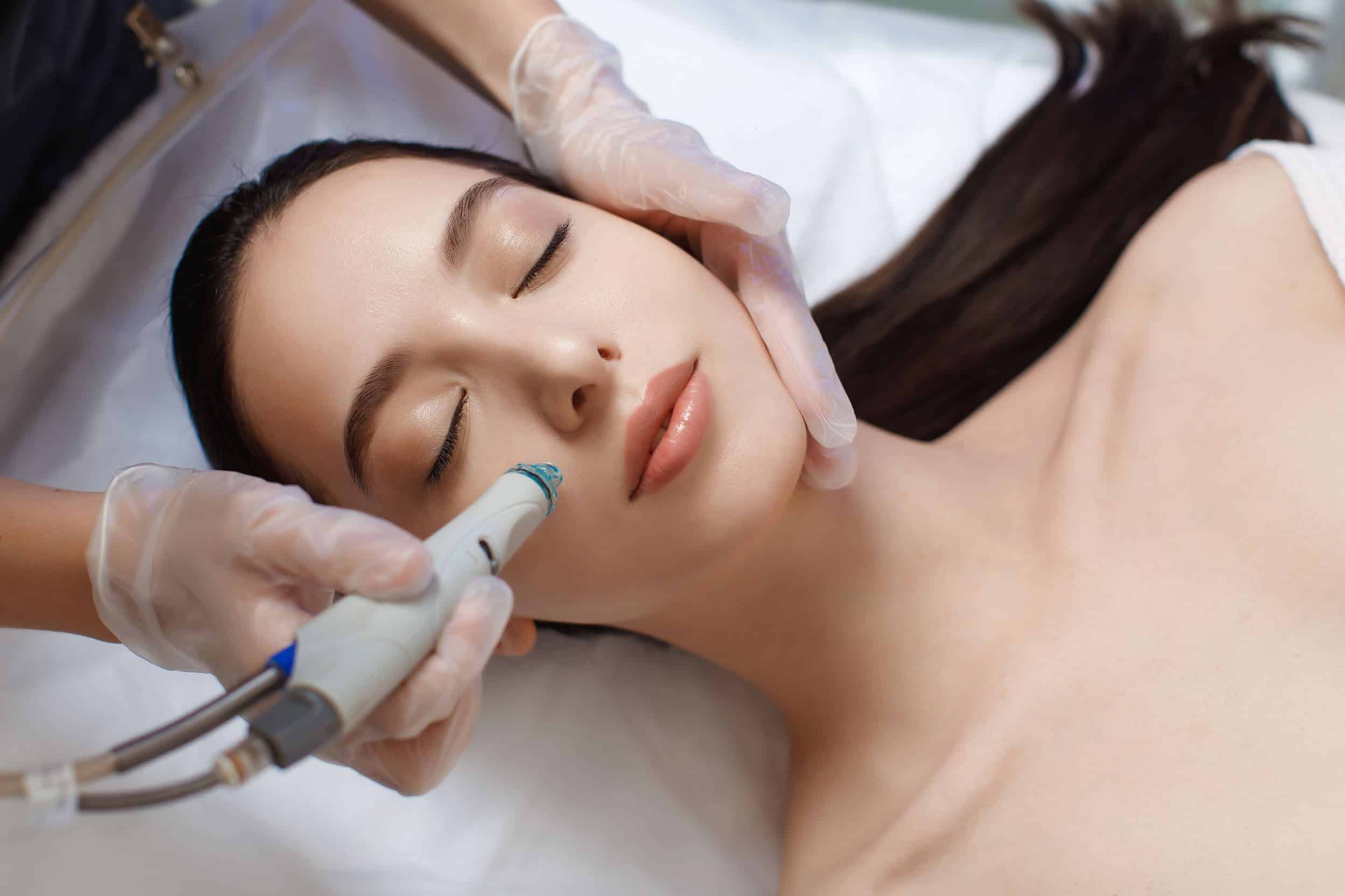 Girl receiving HydraFacial treatment on her Face | Torstveit Medical Aesthetics in Phoenix, AZ